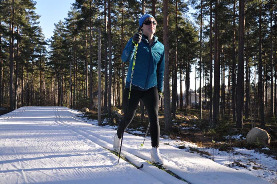 Visually impaired athlete skiing cross country with digital guide system