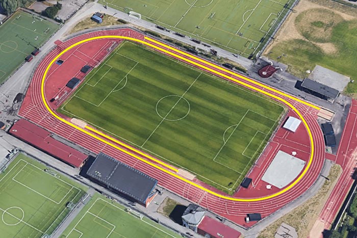 Sports ground with digital guide paths for visually impaired athletes